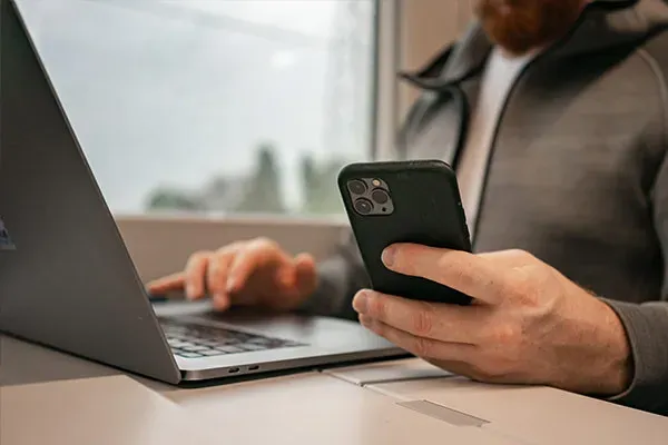 Man looking down at phone