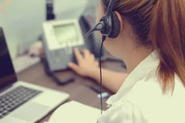 Woman pressing buttons on phone