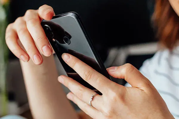 Woman looking intently at phone