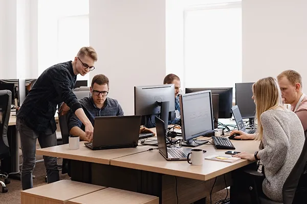 Group of people in an office working on computers