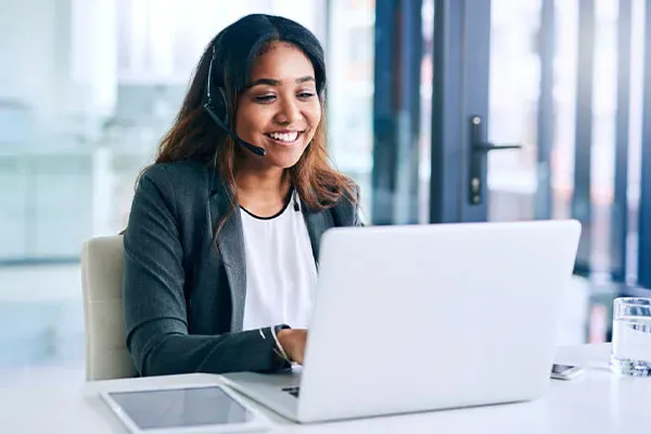 Woman making a SIP trunk call from a laptop