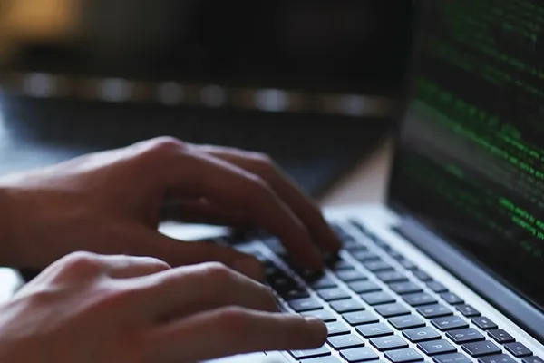 Person typing on laptop