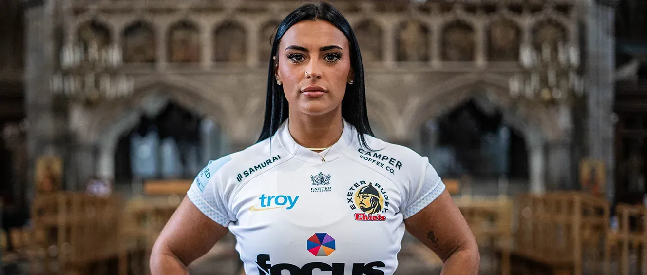 Woman standing strong with Exeter Chiefs t-shirt on