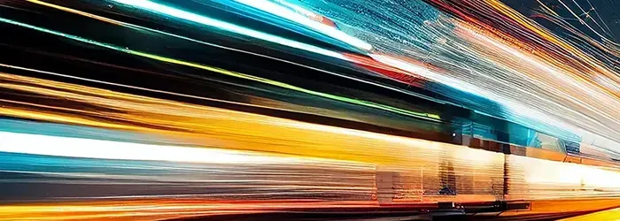 Long exposure of train moving quickly at night