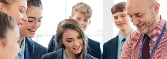 Teacher showing something to students