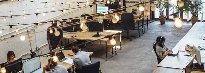 Group of people in an office sitting at desks