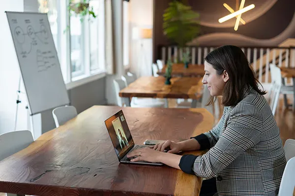 Woman sitting down on a video call