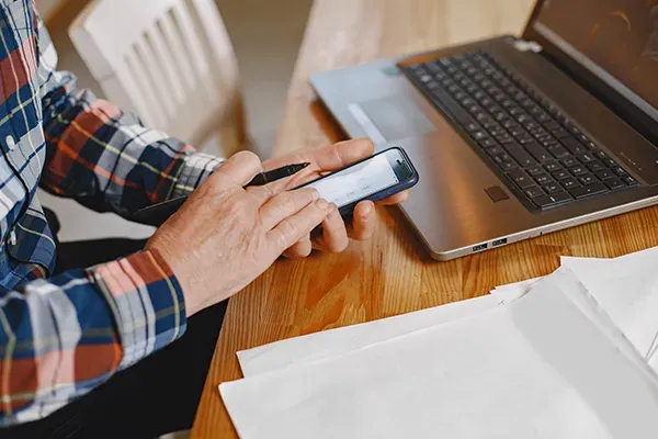 Man scrolling on mobile phone