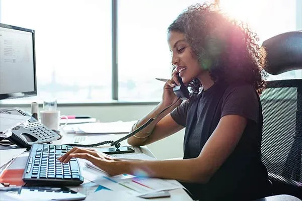 Woman using a newly installed office phone