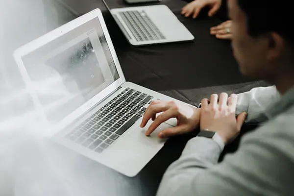 Man looking at macbook