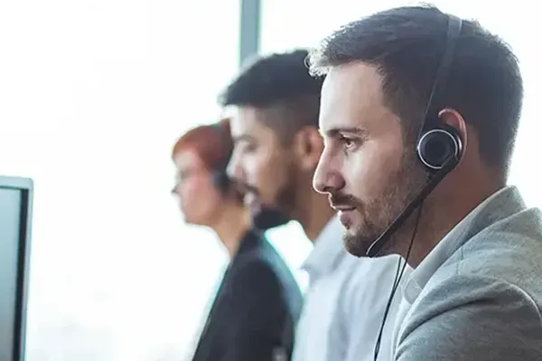 Three people with headsets on