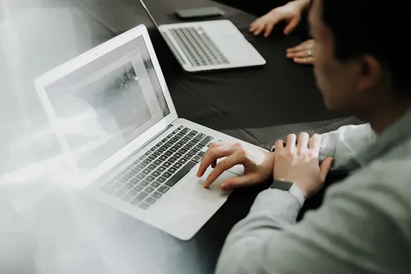 Person typing on laptop