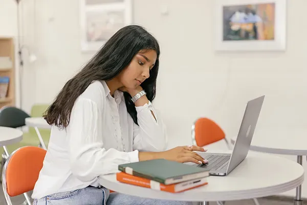 Girl typing on laptop