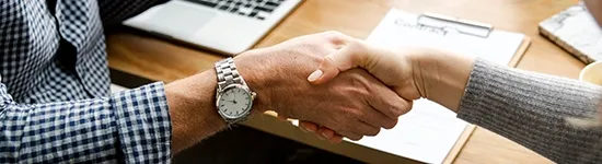 Two people shaking each others hands