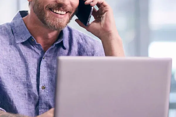 Man making a phone call using the Horizon for icrosoft Teams integration
