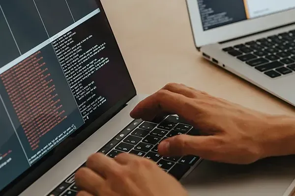 Person typing on laptop