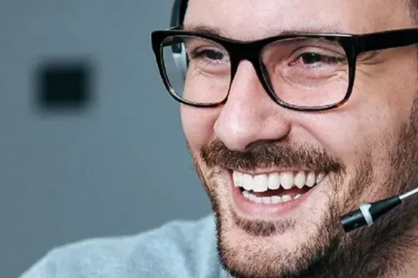Man with glasses and heaset on
