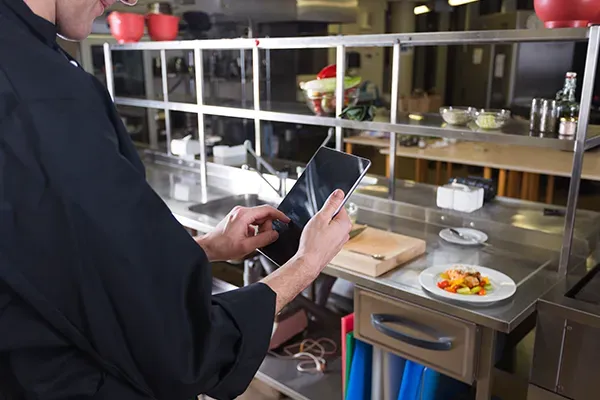 Chef holding tablet