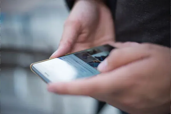 Person using the internet on a mobile phone