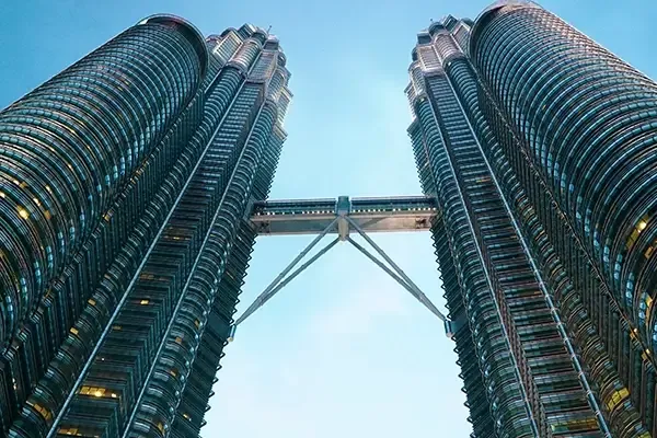 Two large buildings with a bridge connecting them