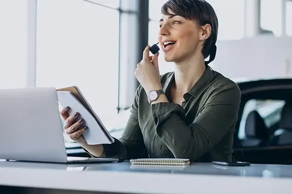 Woman smiling while holding headset microphone