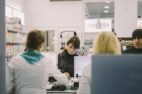People queuing up at pharmacy counter