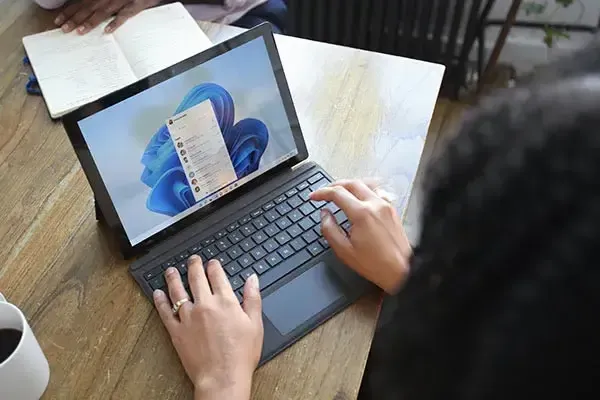 Laptop with Microsoft Team phone system open on contacts list