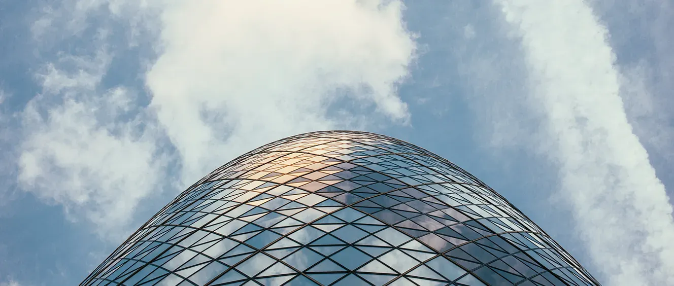 Glass building with clouds