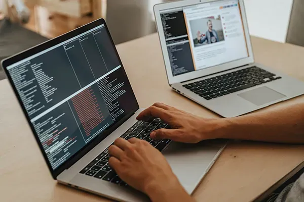 Person typing on laptop